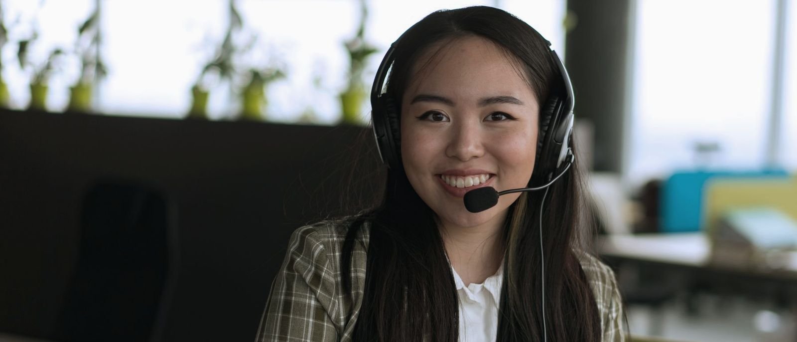 A coordinator with a headset, smiling